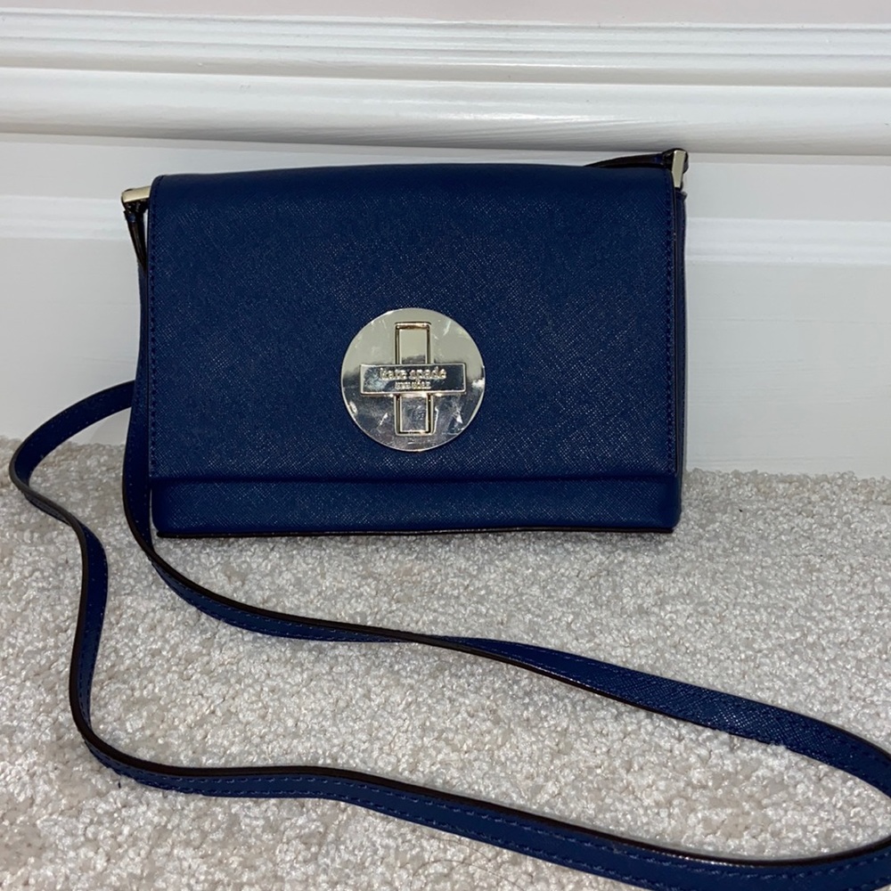 Kate spade cross body bag! So cute. Can easily hold phone and makeup.